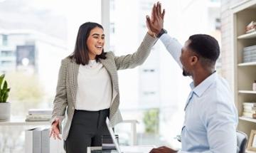 employees giving each other a high-five